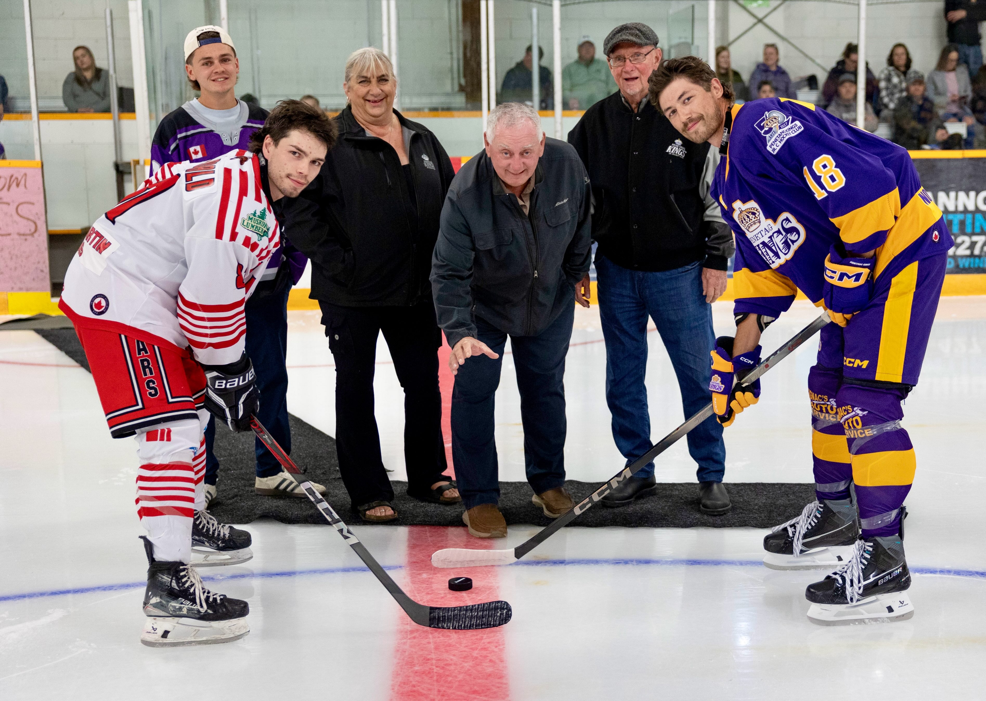 50 Seasons. One Moment at Centre Ice.

Before the puck dropped Friday night, we had the opportunity to recognize four people who each represent an important part of the Penetang Kings story.

Peter Dubeau was one of the men instrumental in establishing the Penetang Kings and served as manager of that inaugural Junior C team. Fifty seasons later, having Peter back at centre ice to help officially open this milestone season was a fitting connection to where it all began.

Larry Cowan was a member of the original Penetang Kings roster. Larry played in the very first Junior C game in franchise history — and holds the distinction of scoring in that game. Five decades later, he returned to The Castle representing that first generation of players who put on a Kings uniform.

Liz Bagnell represents the countless hours of work that happen beyond the ice. Her years of dedication and service to the Penetang Kings have helped carry this organization forward.

Carter Wilson represented a much more recent chapter of Kings history. A hometown King, our 2025–26 captain and known to many around The Castle as “Mr. Game 7,” Carter returned to centre ice Friday night in a new role as a proud Penetang Kings alumni.

Together, Peter, Larry, Liz and Carter took part in the ceremonial puck drop to officially begin the 50th season of Penetang Kings hockey.

Taking the faceoff for the Kings was Carson Thayer, now in his fifth season wearing purple, opposite Aiden MacDonald, another Kings alumni returning to The Castle as a member of the Muskoka Bears.

Then it was time for the 2026–27 Kings to take it from there.

With our 50th season uniforms revealed, the Kings opened season 50 with a 6–1 win over the Muskoka Bears.

And just like that, season 50 was underway.

📸 Keith Todd

-September 11 2026
#penetangkings #pjhl #50thseason #penetangkingsalumni #hometownhockey